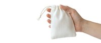 Hand holding a small white drawstring cotton pouch against a white background, perfect for gift packaging or product presentation.