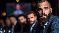 Confident bearded Caucasian businessman in formal attire at corporate meeting, with blurred colleagues in background. Professional portrait in low light setting.