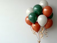 Festive bunch of green, white and orange balloons with gold ribbons against neutral background, celebrating Irish heritage and national pride.