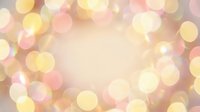 Soft golden and pink bokeh lights creating dreamy blurred circles on warm gradient background for romantic designs and festive celebrations.