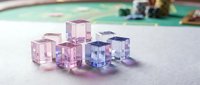 Colorful transparent acrylic cubes scattered on white surface creating modern minimalist composition for design projects and creative presentations.