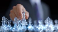 Business strategy concept with glowing chess pieces on dark background, male hand moving king piece in magical light effect for corporate presentations.