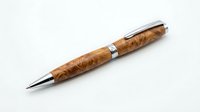 Luxury ballpoint pen with burled wood barrel and chrome accents, isolated on white background, suitable for stationery design, product mockups, and office supplies marketing.