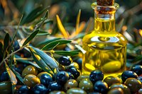 Fresh olive oil in glass bottle surrounded by ripe black and green olives with olive tree leaves, perfect for Mediterranean cuisine and healthy lifestyle promotion.