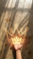 Hand holding glowing golden crown with magical sparkles against textured concrete wall with dramatic shadow patterns for leadership concepts.