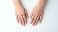 Female hands with natural manicure on white background isolated for beauty skincare cosmetics design healthcare wellness spa treatment concepts.