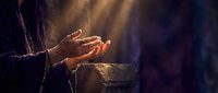 Person warming hands over glowing fire in dark atmospheric setting with dramatic lighting and smoke effects for cozy winter comfort concepts.