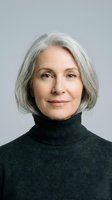 Mature woman with shoulder-length gray hair wearing black turtleneck against neutral background. Studio portrait suitable for business, healthcare, education and corporate communications.