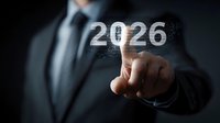 Professional in dark suit points to glowing digital number 2026 against black background, representing future business planning and technological advancement.