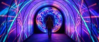 Person walking through futuristic neon tunnel with vibrant purple pink blue light rings creating immersive digital corridor for technology concepts.