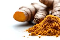 Fresh turmeric root and ground powder on white background, aromatic spice ingredient for cooking Asian cuisine and natural medicine preparation.