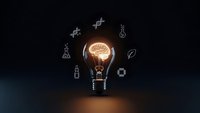 Glowing light bulb with brain filament surrounded by science icons on dark background representing innovation, creativity and bright ideas for business solutions.