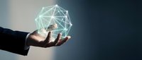 Businessman hand holding glowing geometric network sphere with connected lines representing digital technology, innovation and global connectivity concepts.