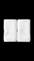 Pair of white folded towels isolated on transparent background, ready for design use on t-shirts, clipart, stickers, print-on-demand products, and sublimation projects.