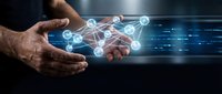 Businessman hand holding glowing network nodes and digital connections, representing data transfer, cloud computing, and technology infrastructure for business solutions.
