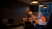 Modern businessman analyzing data security dashboard on transparent tablet in contemporary office with warm ambient lighting during evening hours.