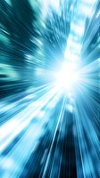 Dynamic radial light burst in turquoise and white creates dramatic speed effect with bright center and radiating energy lines, suitable for tech and sci-fi backgrounds.