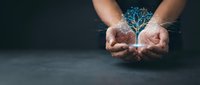 Digital brain hologram glowing in cupped hands of a person against dark background, representing artificial intelligence, innovation, technology, and digital transformation.