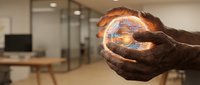 Hands holding glowing digital globe with data visualization, representing global connectivity, technology innovation, and worldwide business networks in modern office environment.