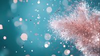Magical pink explosion of powder particles with bokeh effect on turquoise background, macro photography with soft focus and dreamy atmosphere.