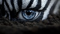 Striking blue human eye with zebra stripe face paint emerging from dark earth, dramatic makeup art for creative projects and fantasy concepts.