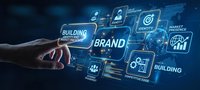 Hand touching digital brand building interface with glowing holographic business icons and network connections on dark blue technology background.