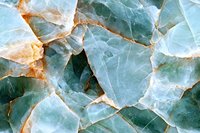 Natural green marble stone texture with gold veining and fractured surface pattern for luxury interior design backgrounds.