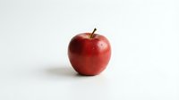 Fresh red apple isolated on white background ready for healthy eating concepts and nutrition designs.