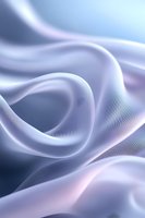 Soft flowing silk fabric in gentle pastel blue and pink creates elegant waves and folds with smooth texture and delicate light effects. Suitable for luxury backgrounds.