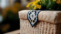 Decorative woven basket with beige cushioning and ornate navy blue trim detail, topped with yellow spring flowers creating cozy home atmosphere.