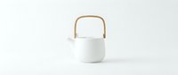 White ceramic teapot with wooden handle on white background, isolated for product design, kitchenware, home decor, and tableware applications.
