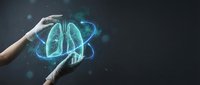 Medical professional hands protecting glowing holographic lungs visualization for healthcare technology and respiratory system protection concepts.