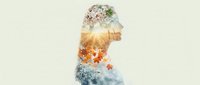 Young woman silhouette with double exposure of four seasons nature scenes showing spring flowers, summer sun, autumn leaves and winter snow.