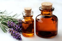 Amber glass bottles with essential oil and fresh lavender sprigs on white background. Natural aromatherapy and herbal medicine concept for wellness and spa.