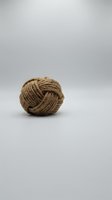Coiled natural jute rope ball isolated on white background, suitable for crafts, packaging, gardening, and design projects.