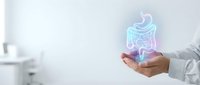 Doctor holding glowing holographic digestive system model in medical office for gastroenterology consultation and patient education purposes.
