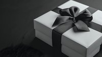 White gift box with elegant black satin ribbon and bow on dark background, monochrome minimalist composition for special occasions and celebrations.