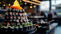 Festive sushi rolls arranged in Christmas tree shape with glowing star topper on black plate, creative holiday catering presentation against blurred restaurant background.