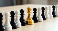Golden chess king piece standing out among black and white pawns on wooden board representing leadership, strategy, and business success concepts.