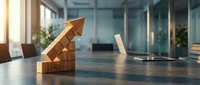 Wooden blocks arranged in ascending steps with upward arrow symbolizing business growth, success and progress in modern office environment.