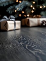 Wrapped gifts in kraft paper with gray ribbons under pine branches with glowing bokeh lights on dark wooden table, festive holiday background with copy space.