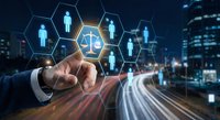 Digital justice concept with businessman touching hexagonal interface displaying scales and human figures against urban night cityscape background.