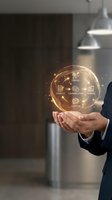 Businessman holding glowing digital sphere with business strategy icons showing workflow process in modern office environment for corporate presentations.