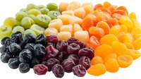 Fresh colorful dried fruits arranged in rainbow pattern with grapes, cherries, kiwi, apricots, and mandarin segments on white background, isolated food composition.