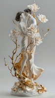 Romantic white porcelain figurine of embracing newlyweds adorned with golden branches and delicate white roses, elegant wedding cake topper on gray background.