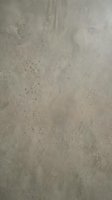 Gray concrete wall texture with natural weathered surface and small holes for industrial design backgrounds and modern architecture projects.