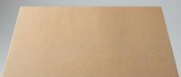 Brown kraft paper texture background with natural fiber pattern for packaging design and eco-friendly projects.