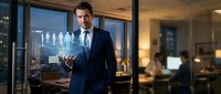 Professional businessman in navy suit presenting holographic team icons in modern corporate office during evening hours for leadership and management concepts.