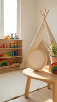 Cozy children playroom with beige teepee tent, wooden toys, rainbow stacking toys and natural light creating warm educational environment for kids development.