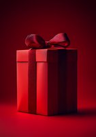 Elegant red gift box with satin bow on dark red background, dramatic studio lighting creates luxurious mood for Valentine's Day, Christmas or anniversary celebrations.